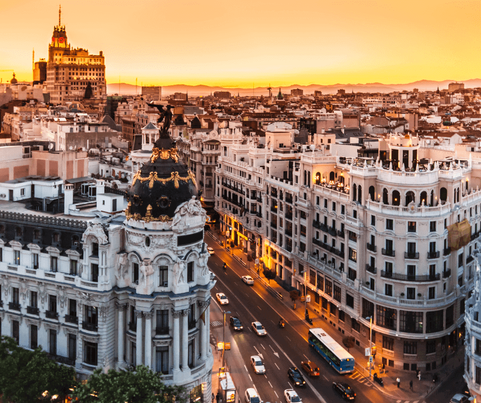 Sunset view over Madrid's skyline featuring the Metropolis Building and Gran Vía from the rooftop of Círculo de Bellas Artes.
