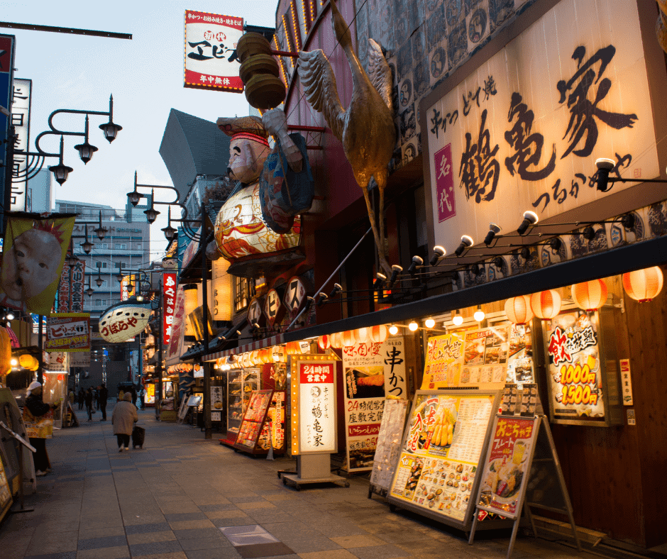 Bright restaurant signs and lanterns line Osaka's Dotonbori district, one of Japan's most famous streets for local food, nightlife, and entertainment.