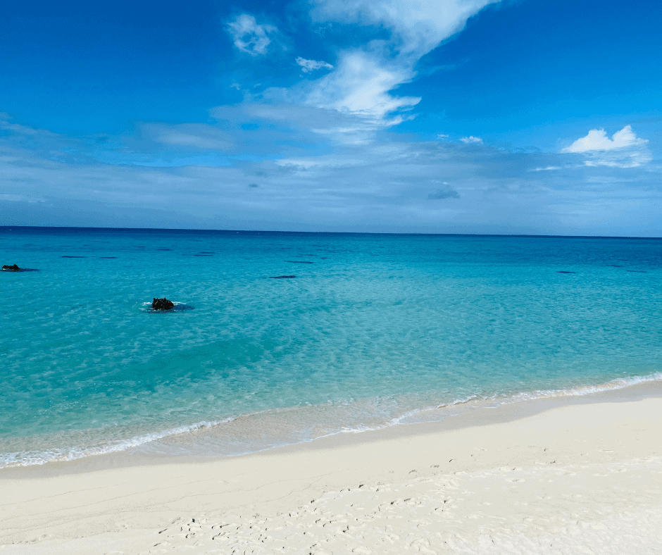 White sand beach and crystal clear turquoise water in Okinawa, Japan, showcasing one of the country's most beautiful tropical coastal destinations.