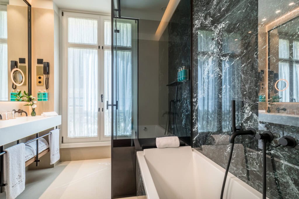 Spacious marble bathroom in a suite at Palacio Gran Vía hotel, Granada, Spain
