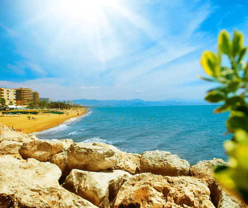 andy beach and blue Mediterranean Sea along the coast of Spain on a sunny day