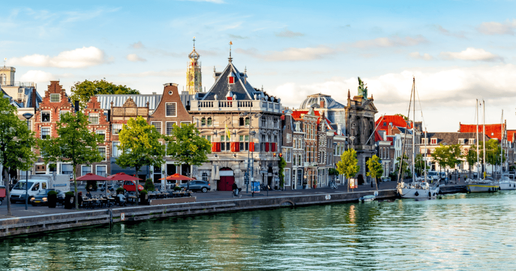 Historic waterfront buildings along a canal in Haarlem, Netherlands