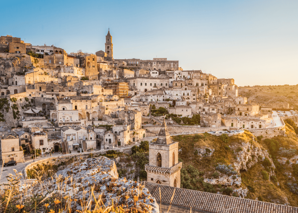 Panoramic view of the Sassi cave dwellings in Matera, Italy at sunset