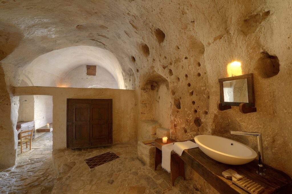 Stone bathroom inside a cave suite at Sextantio Le Grotte della Civita in Matera