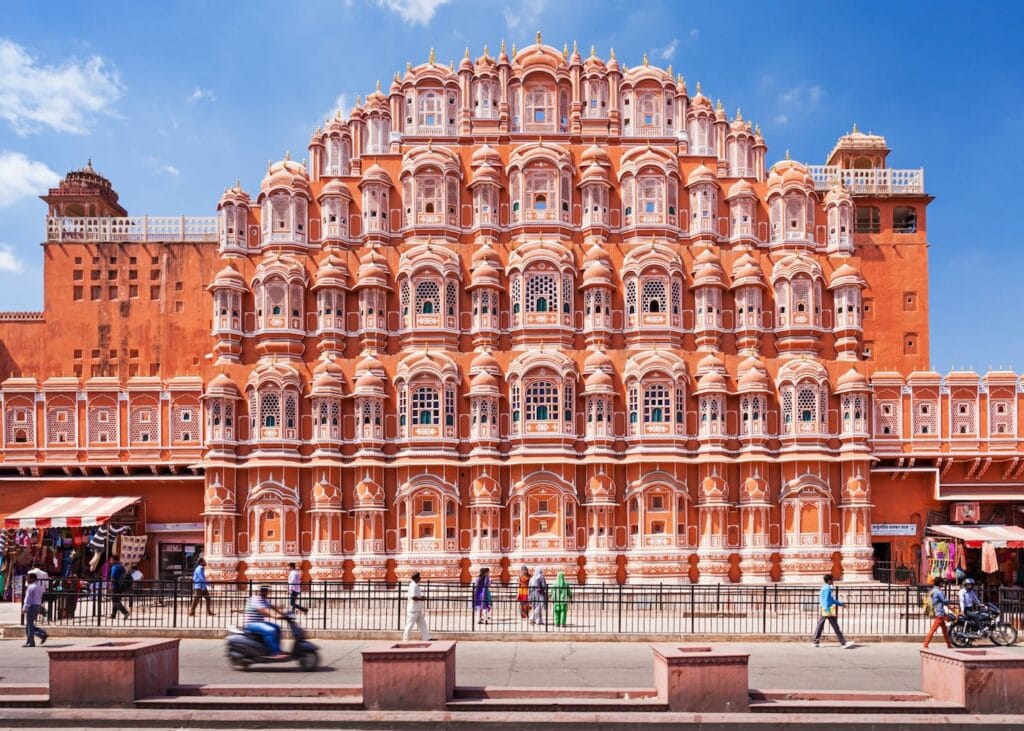 The pink honeycomb facade of Hawa Mahal in Jaipur with its hundreds of small windows.