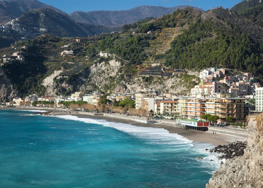 Maiori's long sandy beach and waterfront backed by the mountains of the Amalfi Coast.