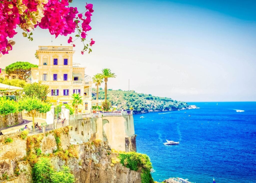 Elegant villa overlooking the sea in Sorrento surrounded by blooming bougainvillea.
