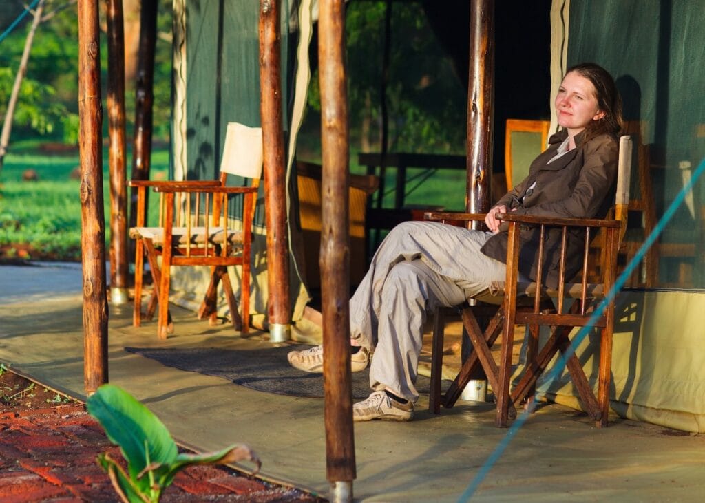 Example of safari clothing with neutral layers, comfortable pants, and a light jacket
